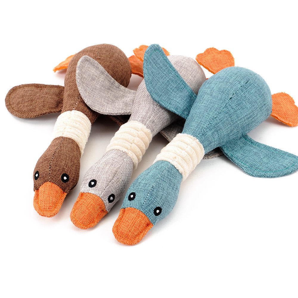 Squeaky plush goose dog toys in brown, grey and blue